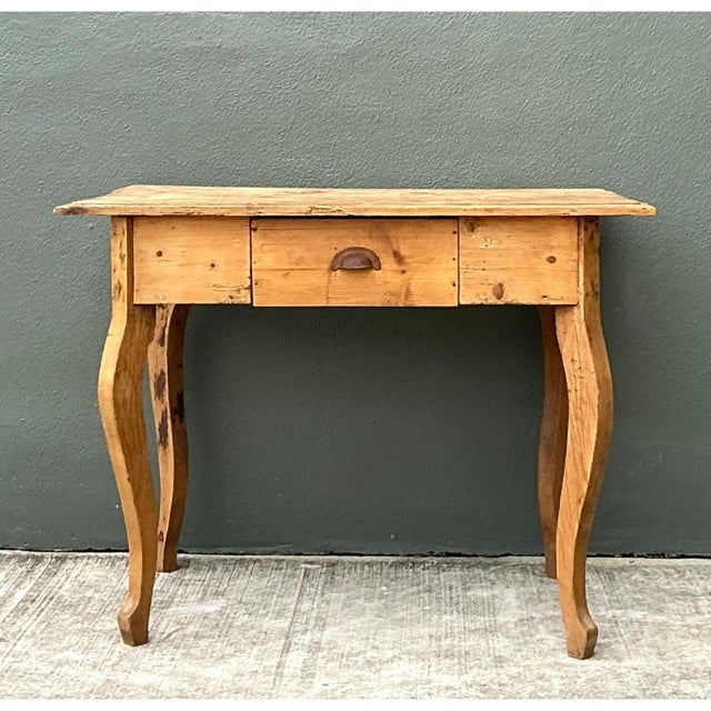 This vintage rustic writing desk is crafted from pine and embodies the charm and simplicity of early 20th-century rural...