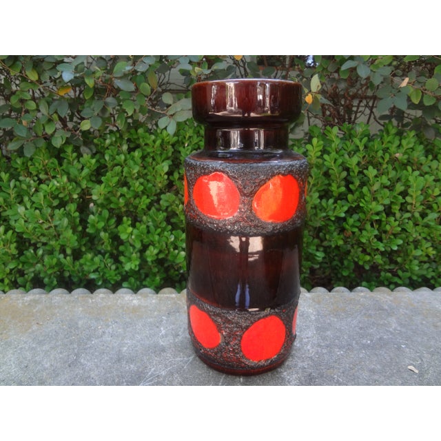 West German Glazed Pottery Vase With A Geometric Design. This handsome mid century glazed pottery vase executed in red and...