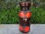 West German Glazed Pottery Vase With A Geometric Design. This handsome mid century glazed pottery vase executed in red and...