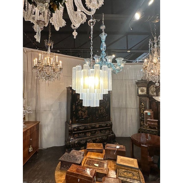 Modern Murano opal glass tronchi chandelier. The chandelier has been professionally rewired, comes with matching chain and...