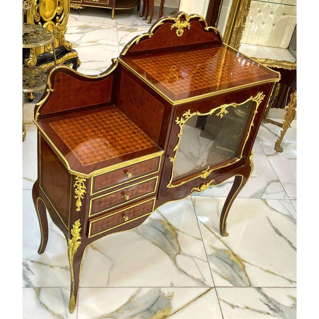 Exquisite Louis XV style bedside cabinet, beautifully crafted with elegant marquetry and a rich, polished wood finish....