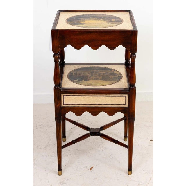 Theodore Alexander two drawer side table. Two tiers with painted scenes and two drawers with scalloped detail, brass...