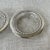 Set of three unbranded Sterling silver and crystal coasters. Marked Sterling. No makers mark. Polished. All are in good...