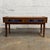 This Danish teak low entry cabinet has a great mid-century look, with a long low form, raised side edges, tapered legs,...