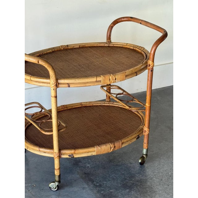 Can hold up to 6 bottles of wine or liquor, on wheels. 32”L x 22.5”D x 29”H in great vintage condition