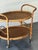 Can hold up to 6 bottles of wine or liquor, on wheels. 32”L x 22.5”D x 29”H in great vintage condition