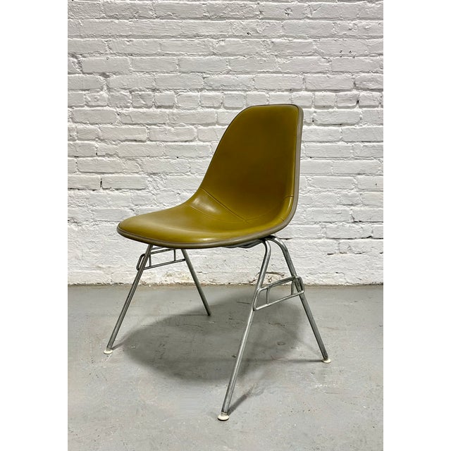 Authentic Mid Century Modern stacking molded fiberglass shell chair designed by Charles and Ray Eames for Herman Miller,...
