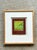 This vintage framed abstract mixed media artwork presents a playful interpretation of postal imagery through bold color,...