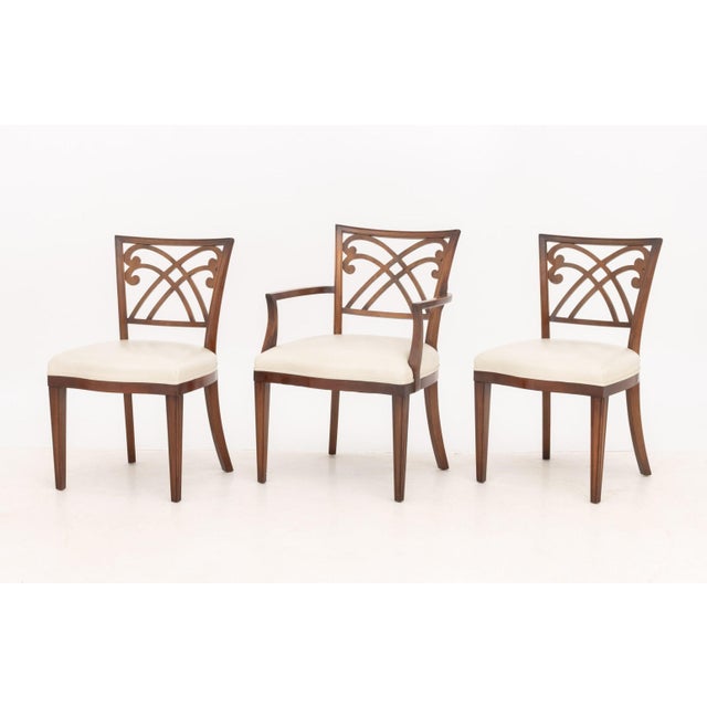Set of Six Regency Style Mahogany Arm Chairs, with carved scroll form backrest and beige leather seats. 37.5" H x 18" W x...