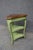 Compact Baker Furniture corner side table featuring a softly distressed sage green painted finish and shaped cherry top....