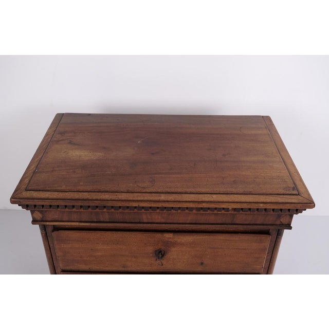 Louis xvi chest of drawers dating from around 1760. The piece has a hand-polished finish and features characteristic...