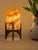 Comet pairs a hand-carved Egyptian alabaster shade with a geometric walnut base, combining contemporary form with...