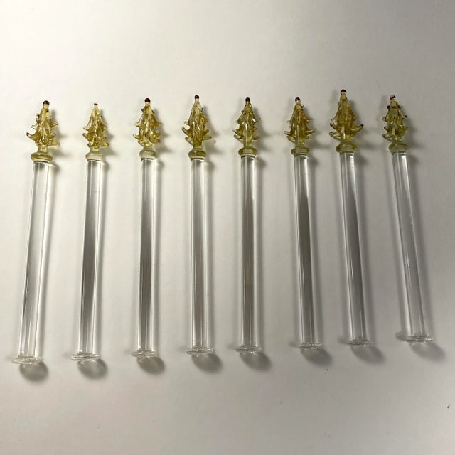 Charming set of 8 vintage blown glass Christmas Tree swizzle sticks. Clear glass stems with gold trees, painted red,...