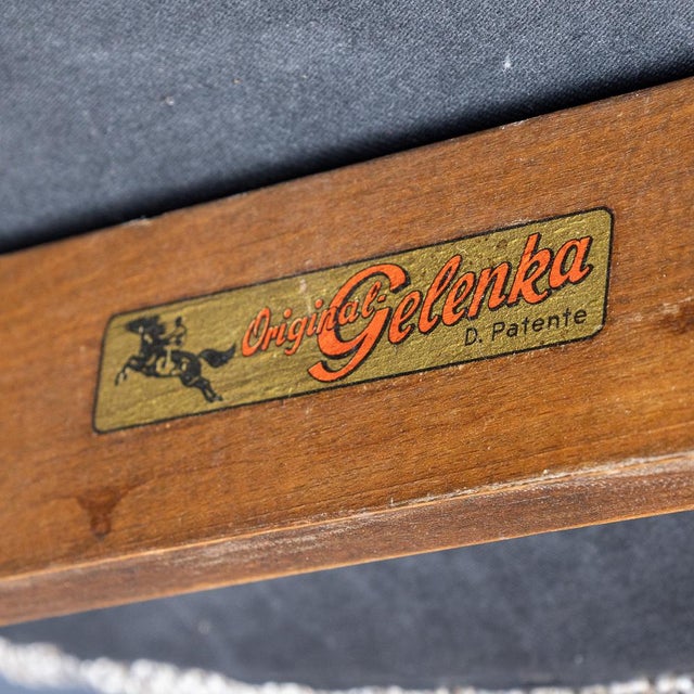 A 20th century pair of winged armchairs by gelenka of germany, a company associated with the bauhaus movement and noted...