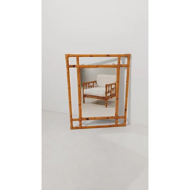 We offer for sale a large rectangular mirror, made of thick bamboo canes that intertwine to create a minimalist and...