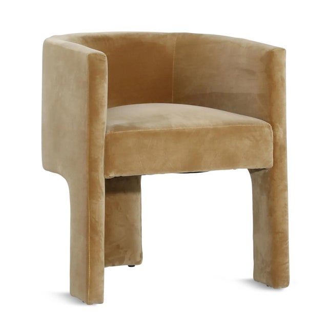 Luxe caramel color velvet upholstered arm chair. U back design with three legs. Seat height is 20" and seat depth is...