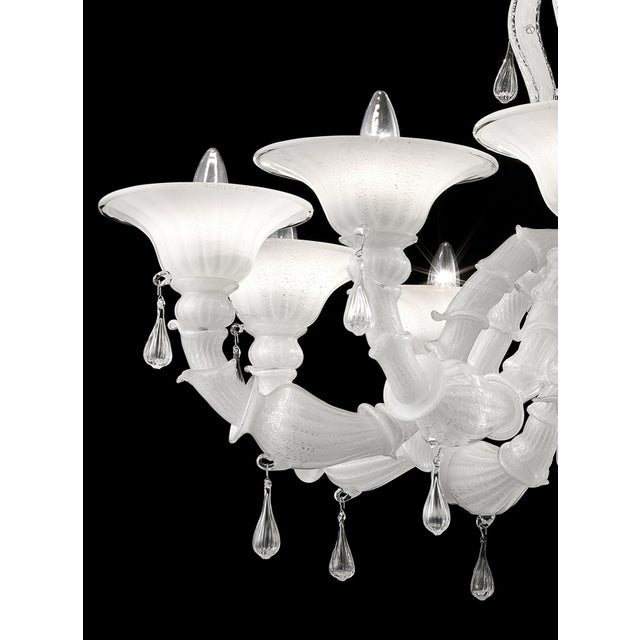 Contemporary Lively white “Cà Rezzonico” Murano Glass Chandelier. The arms are working in traditional working “Cà...