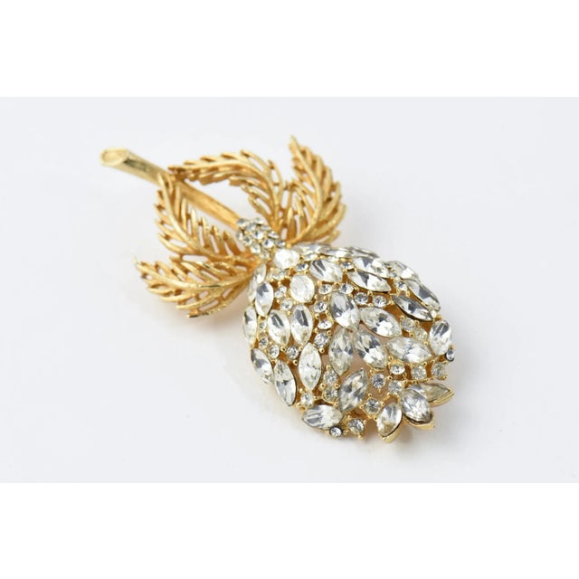 Impressive three dimensional large crystal flower brooch with a gold tone stem and leaves. Please see the measurements...