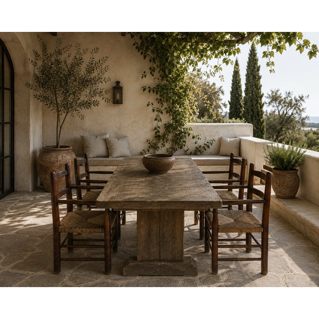 This vintage set of four fireside chairs is built from solid pine in a dark-toned stain, with a ladder-back frame, hand-...