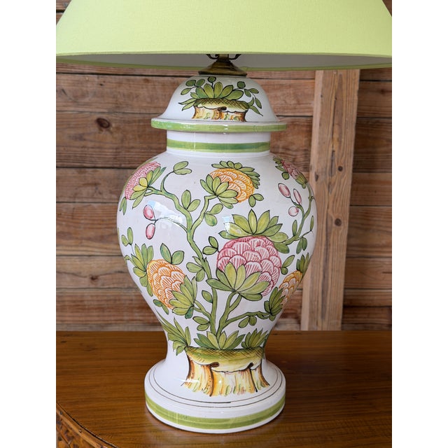 Absolutely stunning pair of vintage glazed pottery table lamps with hand-painted floral motifs in soft greens, blush...