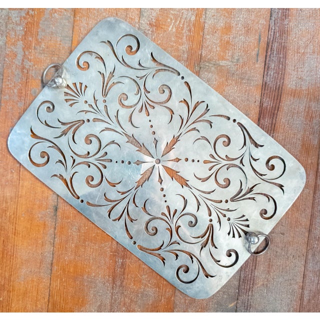 We are selling this gorgeous English George II sterling silver pierced insert. This insert would have been used a dish...