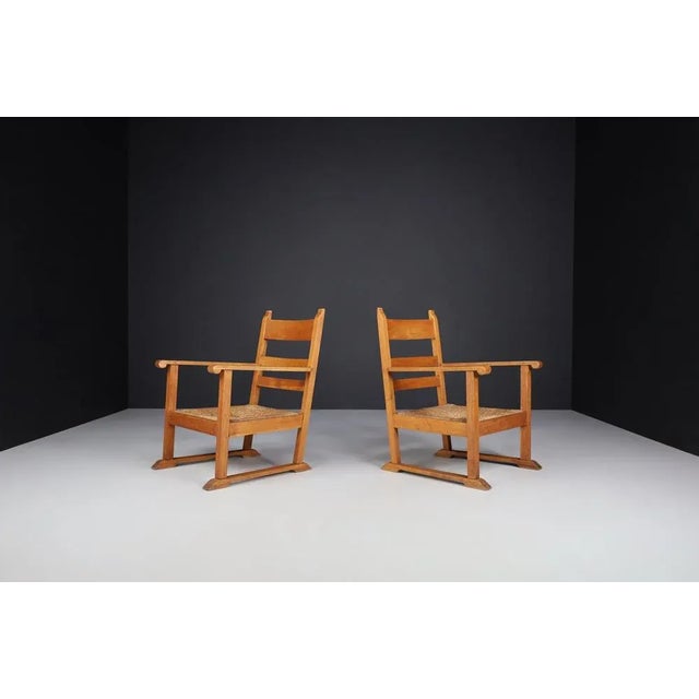 Upgrade your living space with this enchanting set of two rustic armchairs, each a stunning example of Mid-20th-century...