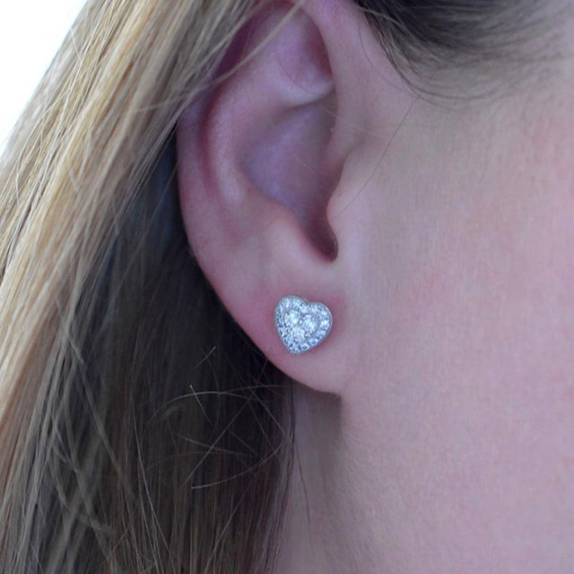A breathtaking expression of romance and luxury, this elegant pair of heart-shaped stud earrings is crafted in solid 18k...