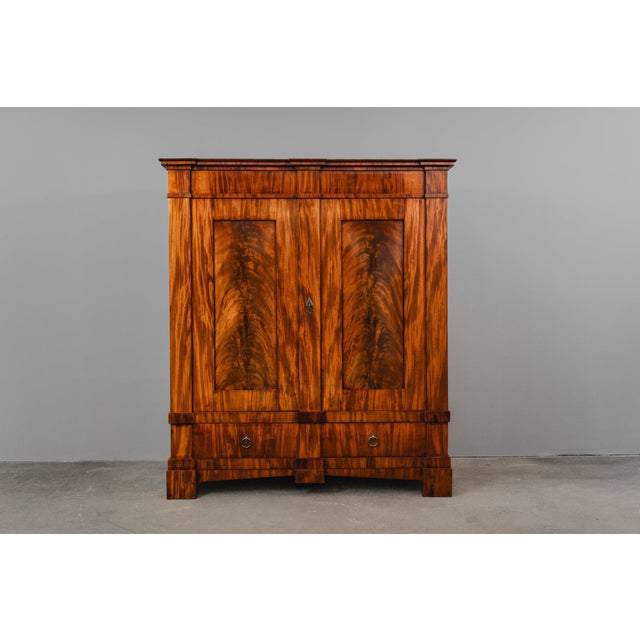 Item: Large wardrobe Period & Style: Biedermeier - first half of the 19th century Features: - Impressive and practical...