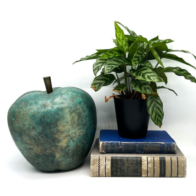 Striking vintage apple sculpture crafted in painted terracotta and finished in a richly mottled verdigris palette. This...
