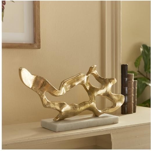 The Cohen Gold Sculpture Elevate your coastal décor with this large driftwood-inspired abstract sculpture. Set on a white...