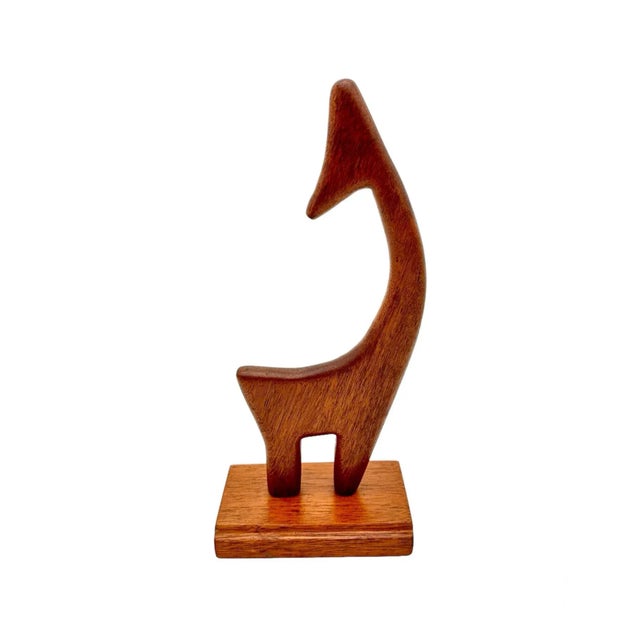 This vintage modernist wooden giraffe sculpture is a unique addition to any collection. Expertly crafted from wood, this...