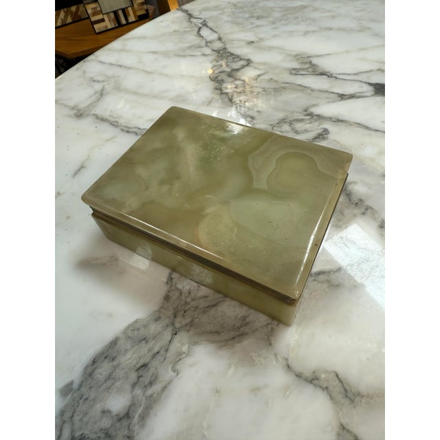 This is a rectangular vintage trinket box made from polished green onyx stone, featuring natural banding and soft earthy...