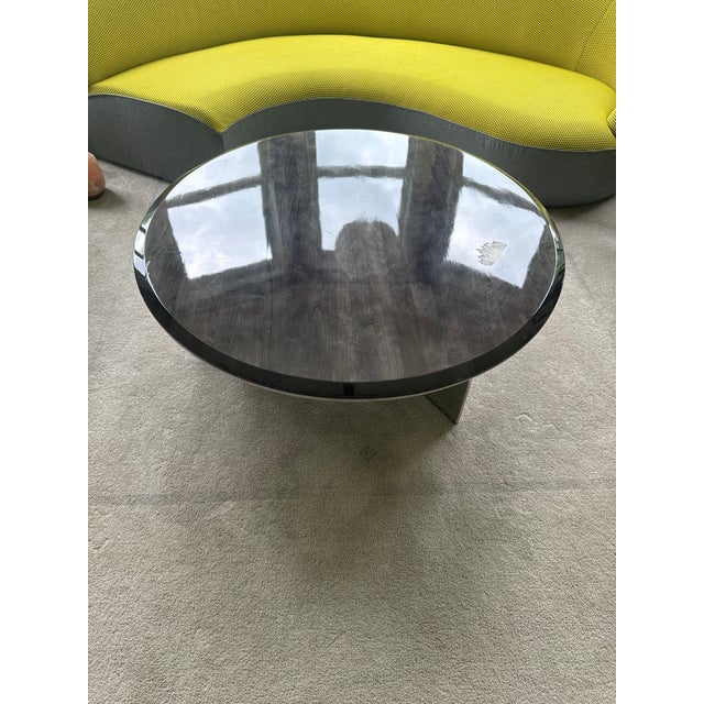 The Roche Bobois ALTO Low round aluminium and wood coffee table perfect for a nice cozy home interior with stunning silver...