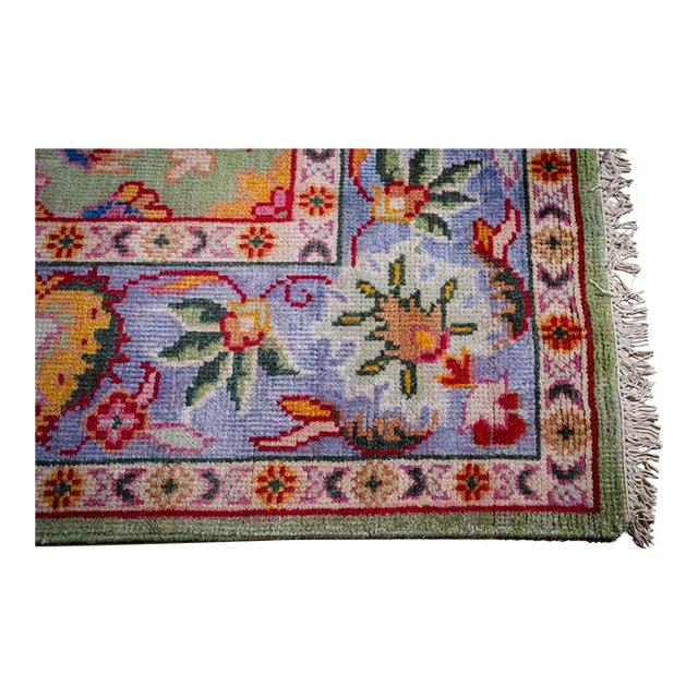 A hand-knotted wool Oushak, made in India and measuring 8' x 10'. Oushak weaving is known for large-scale, softly drawn...