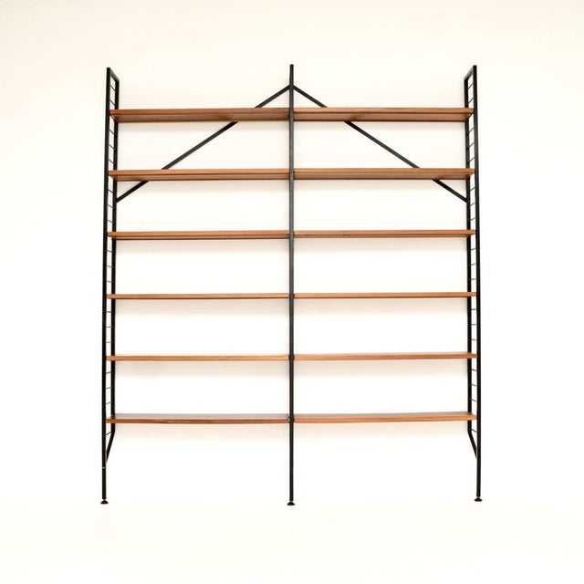A very stylish and practical vintage teak ladderax bookcase shelving unit. This was made in England, it dates from the...