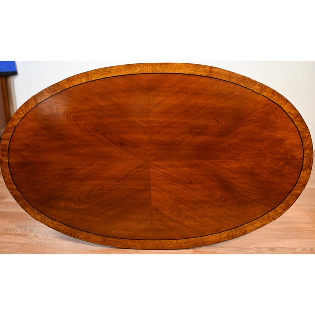 We are pleased to offer this beautiful English Regency style Coffee table, from the 1940s. This table is made of Walnut...