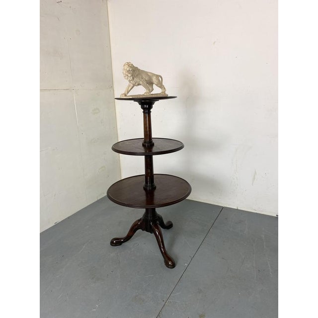 An exceptionally fine three tier George II period mahognay dumb waiter servant. The table can be dissasembled. Can also be...