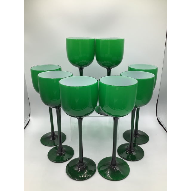 A fabulous set of eight 1960s hand blown Carlo Moretti Italian cased glass Kelly green with white interior. These tall...