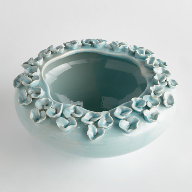 The multifloral design of this vase is truly extraordinary. The sculpted buds are handapplied and each piece is uniquely...
