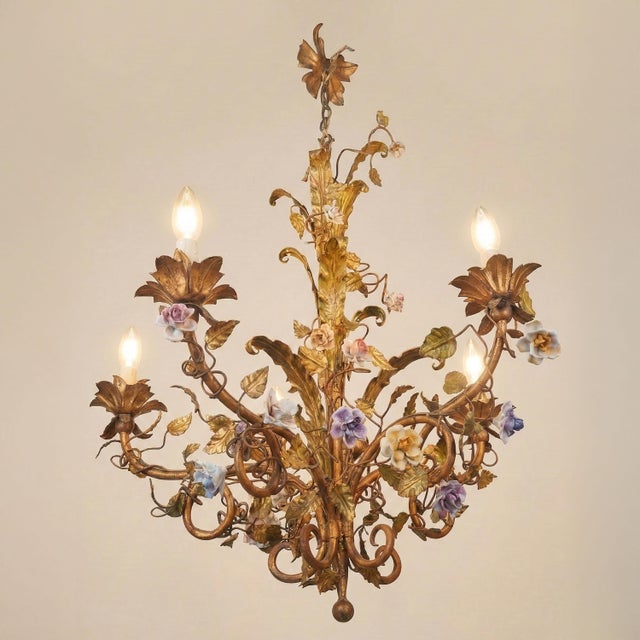 A veritable hanging garden, this six-arm "basket" chandelier is a celebration of lightness and springtime refinement....