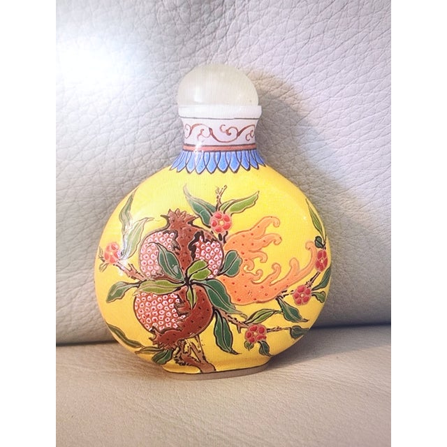 Qing Dynasty Snuff bottle, featuring peach blossoms on one side and pomegranates on the other side. 3in tall and 2:in...