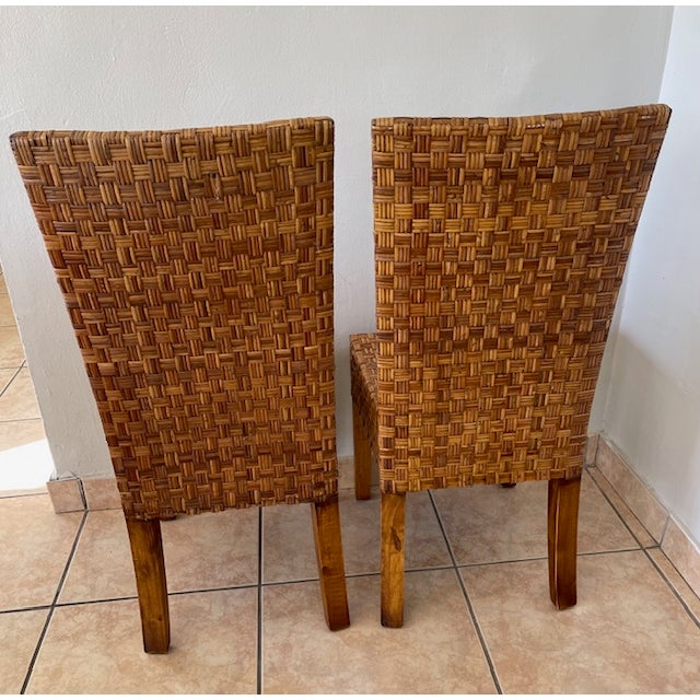 Gorgeous set of vintage rattan chairs. These chairs are quite sturdy and have thick all wood construction underneath as...