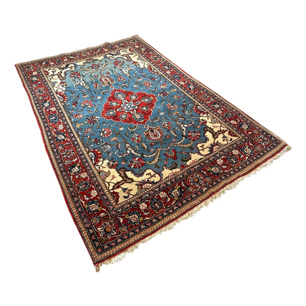 Hand-Knotted Blue Field Rug with Floral Medallion For Sale