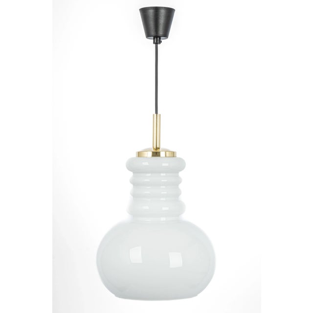 Large white opal glass pendant light by peill & putzler, manufactured in germany, circa the 1970s. High quality and in...