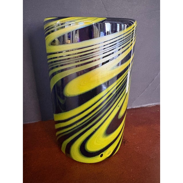 Hand-blown studio art glass tumblers in rich cobalt blue with chartreuse swirl detailing. Each glass is individually made...