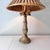 Vintage gold brushed faux bois palm tree table lamp with matching finial.