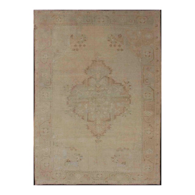 Vintage Turkish Oushak Rug With Faded Sand Field and Pale Brown Medallion For Sale