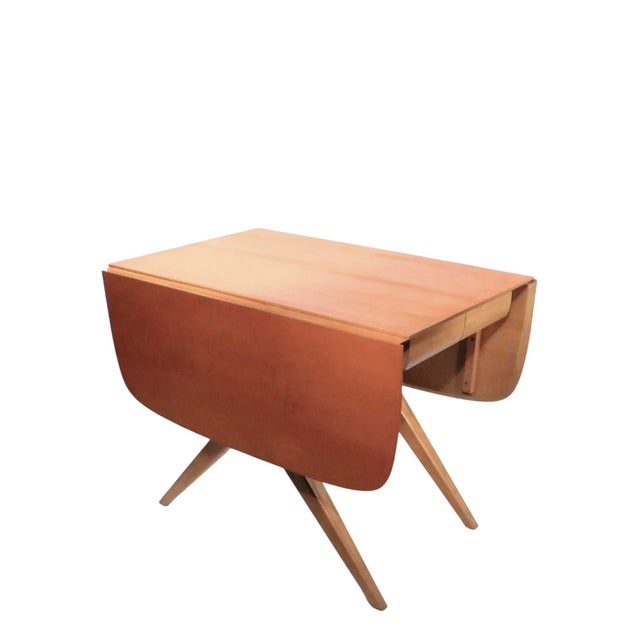 Classic Mid Century drop leaf dining table having a rectangular top ( W 24" ) , which features two drop leaves, enabling...