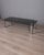 Coffee table with cylindrical chromed metal legs and a smoked glass top, designed by Marco Zanuso for Zanotta, 1970s. I...