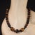 Elevate your accessory game with this stunning 25-inch multi-color Tiger's Eye necklace, designed to capture the warm,...